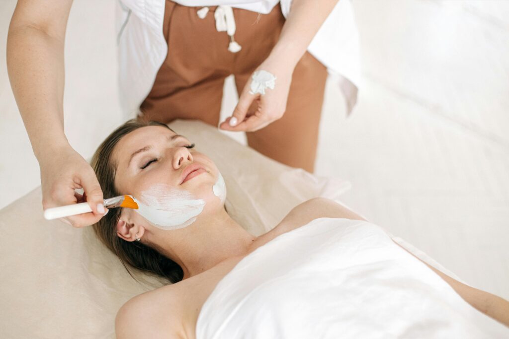 pexels-photo-5659018-5659018 Woman receiving a rejuvenating facial treatment at a spa, promoting skin care and relaxation.