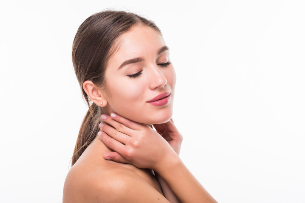 Beautiful sensual woman touching her face isolated on white background. Beauty and skincare concept. Spa. beautiful sensual woman touching her face isolated white wall beauty skincare concept spa